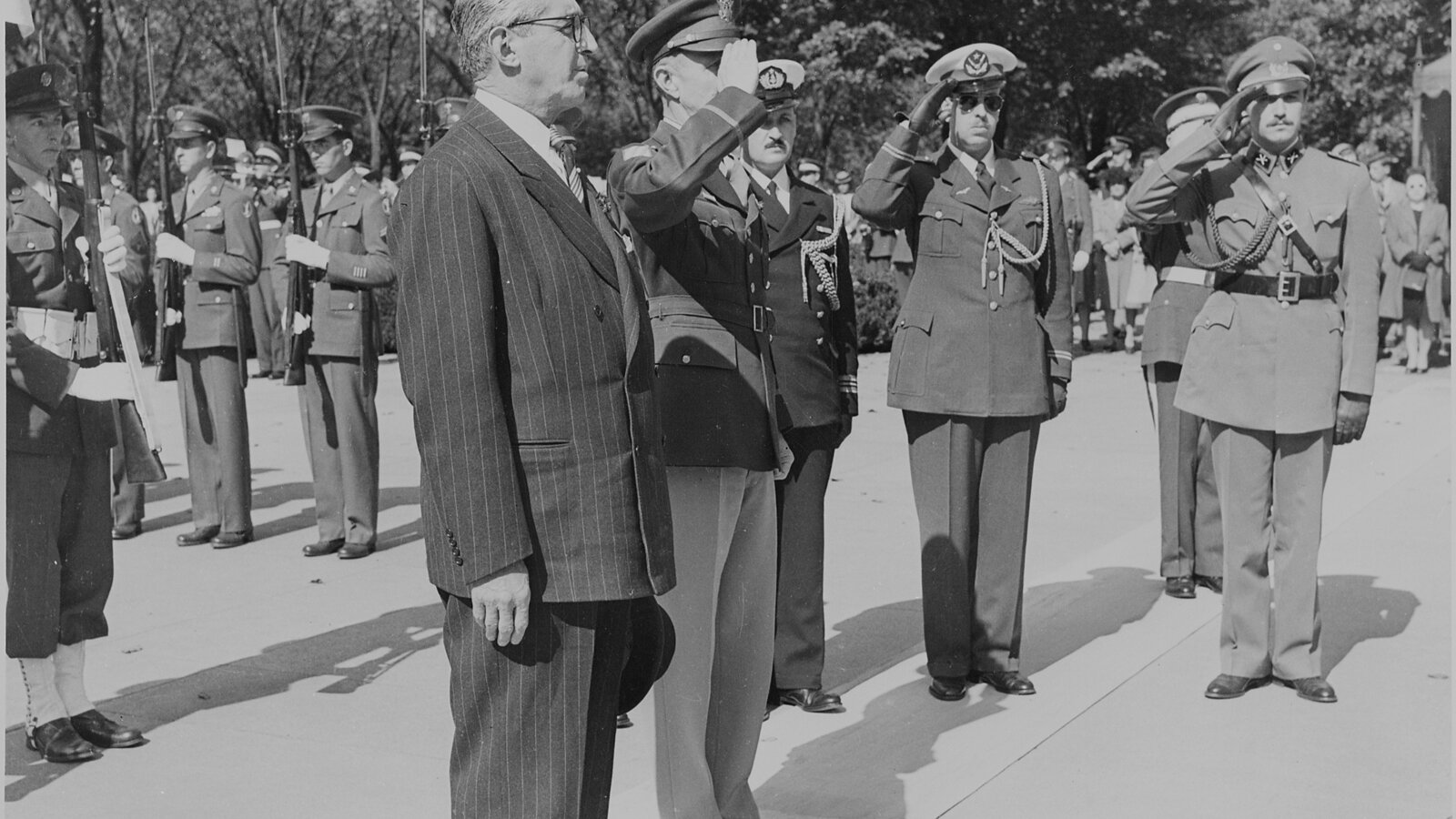 President Juan Antonio Ríos of Chile standing at attention at the Tomb of the Unknown Soldier, Arlington National Cemetery, on his October 1945 state visit to the United States