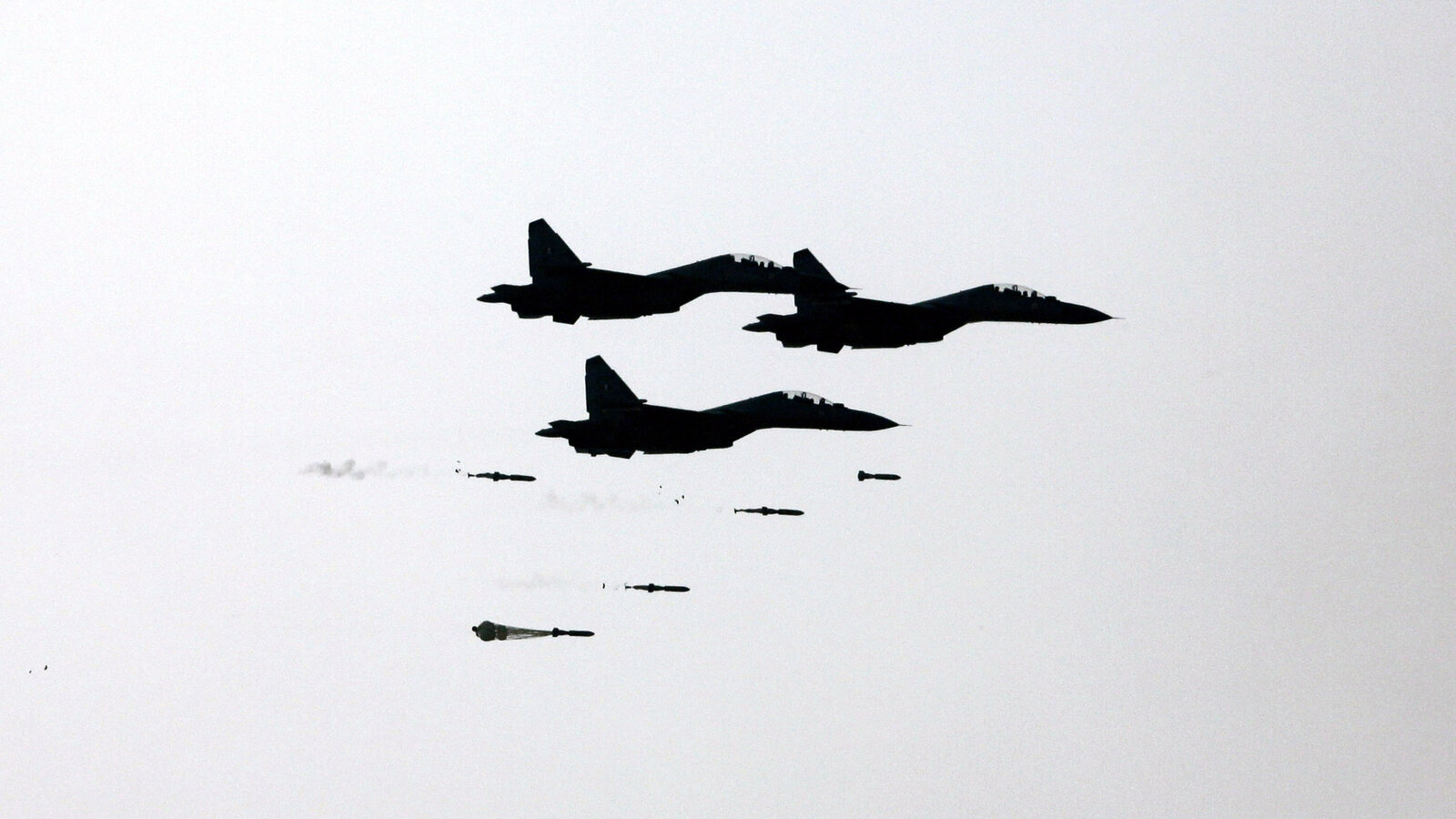 Three Indian Air Force Su-30 MKI fighters dropping bombs at Iron Fist 2013 firepower exercise, Pokhran, February 2013