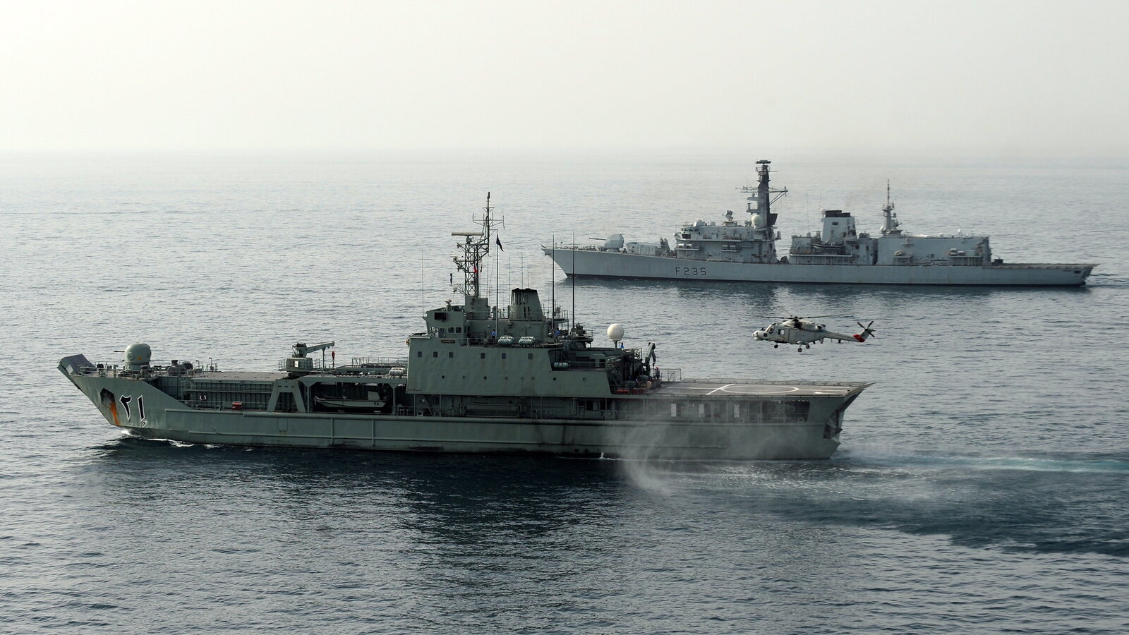 Royal Navy of Oman vessel Nasr al Bahr alongside HMS Monmouth during Exercise Khanjar Ha'ad, May 2011