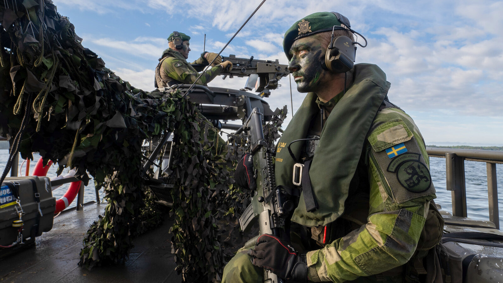 Swedish Armed Forces personnel provide speedboat security for U.S. Marines during a HIMARS transportation exercise in the Baltic Sea, BALTOPS 24, June 2024