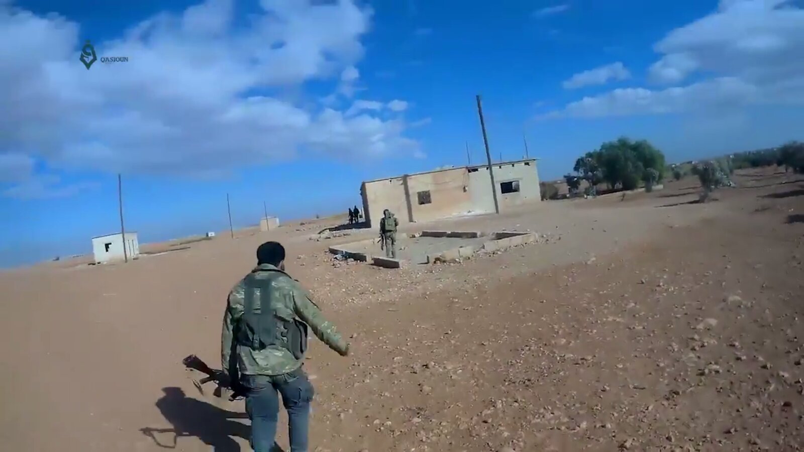 Hayat Tahrir al-Sham fighters in Mushairfa, northeastern Hama province, Syria