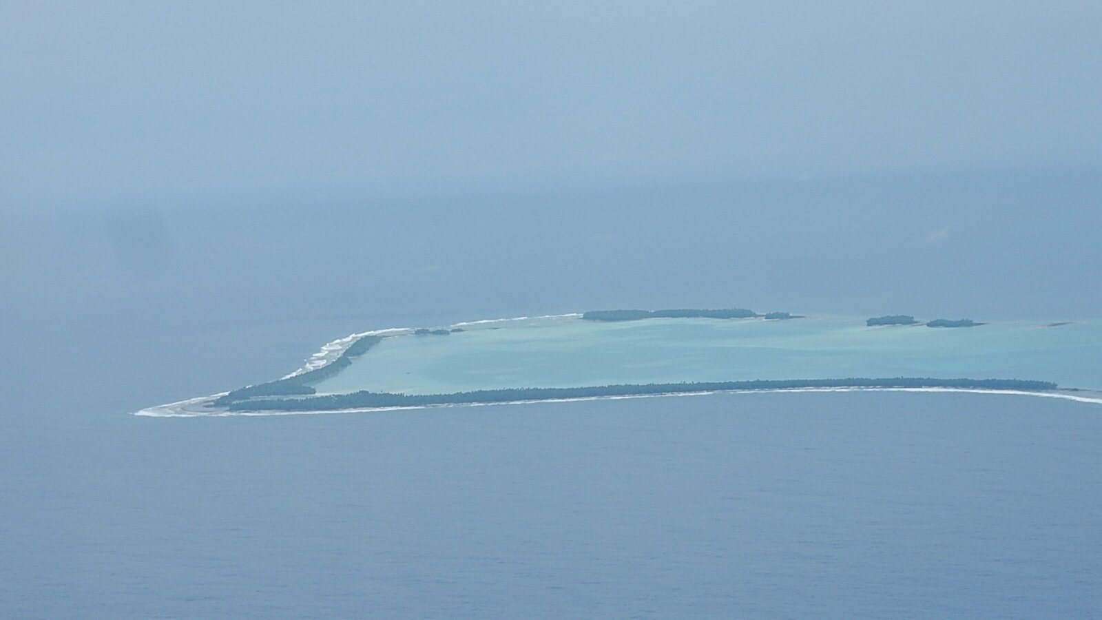 Aerial photograph of a Tuvalu atoll near Funafuti showing the ring-shaped Pacific atoll formation, July 2016