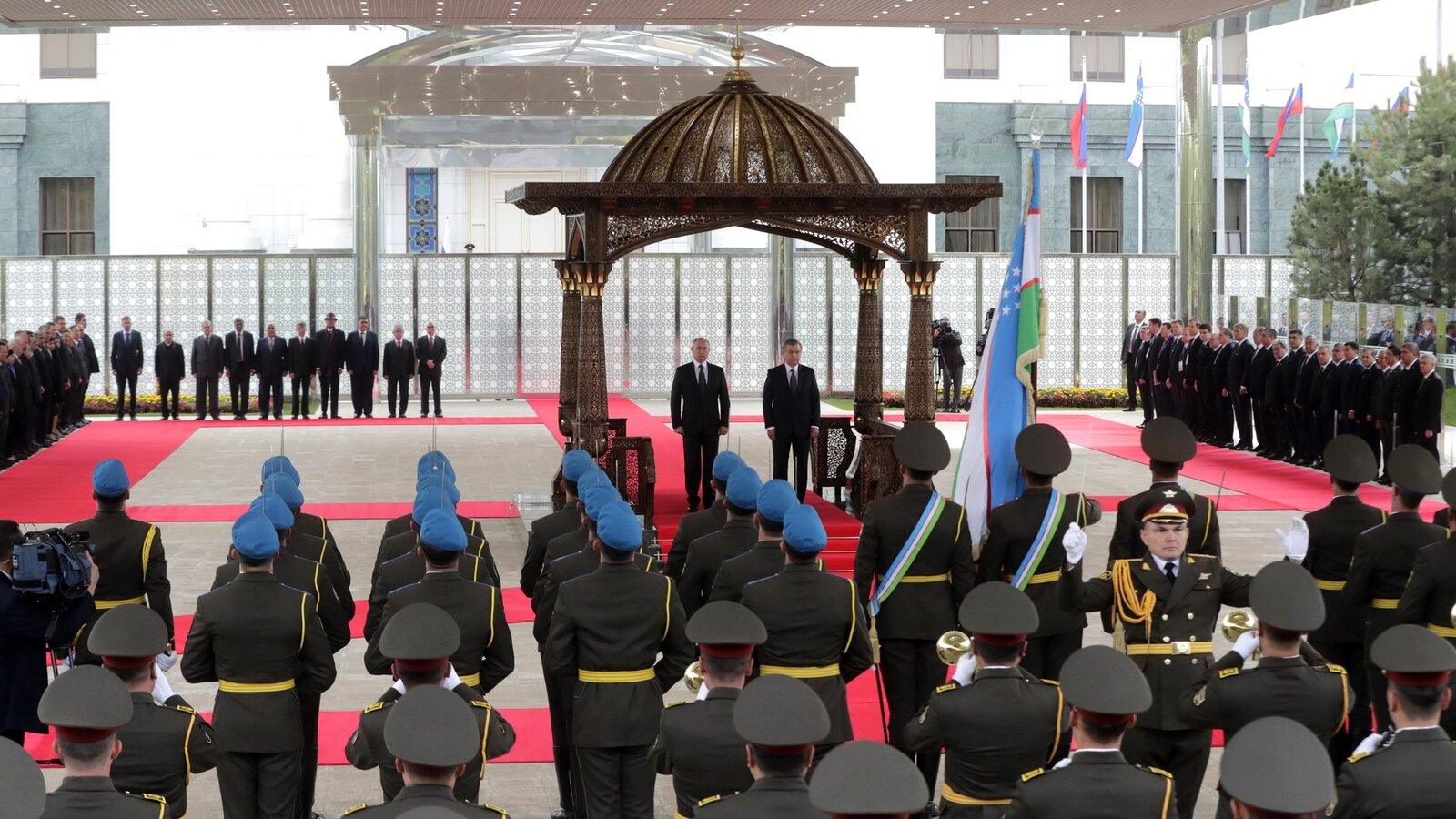 Vladimir Putin and President Shavkat Mirziyoyev review honor guards in Tashkent during Putin's state visit, October 2018